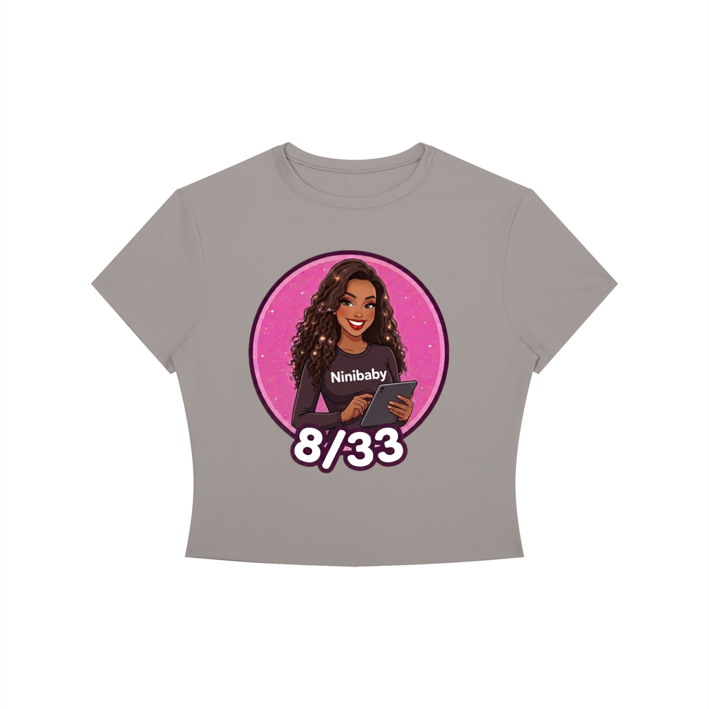 A gray short-sleeve crop top t-shirt featuring a circular graphic of a woman with the text 'Ninibaby' and '8/33' on a white background.