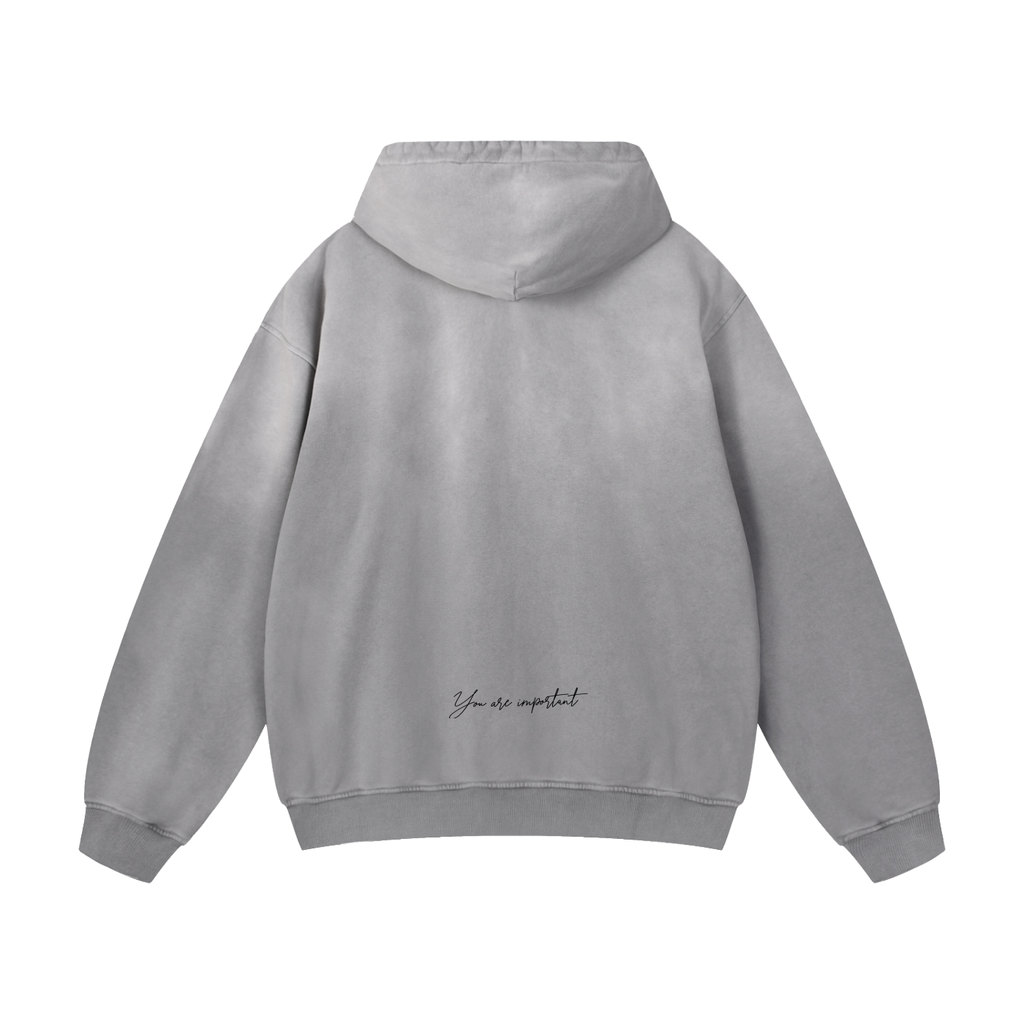 Gray hoodie with green text on the back against a white background