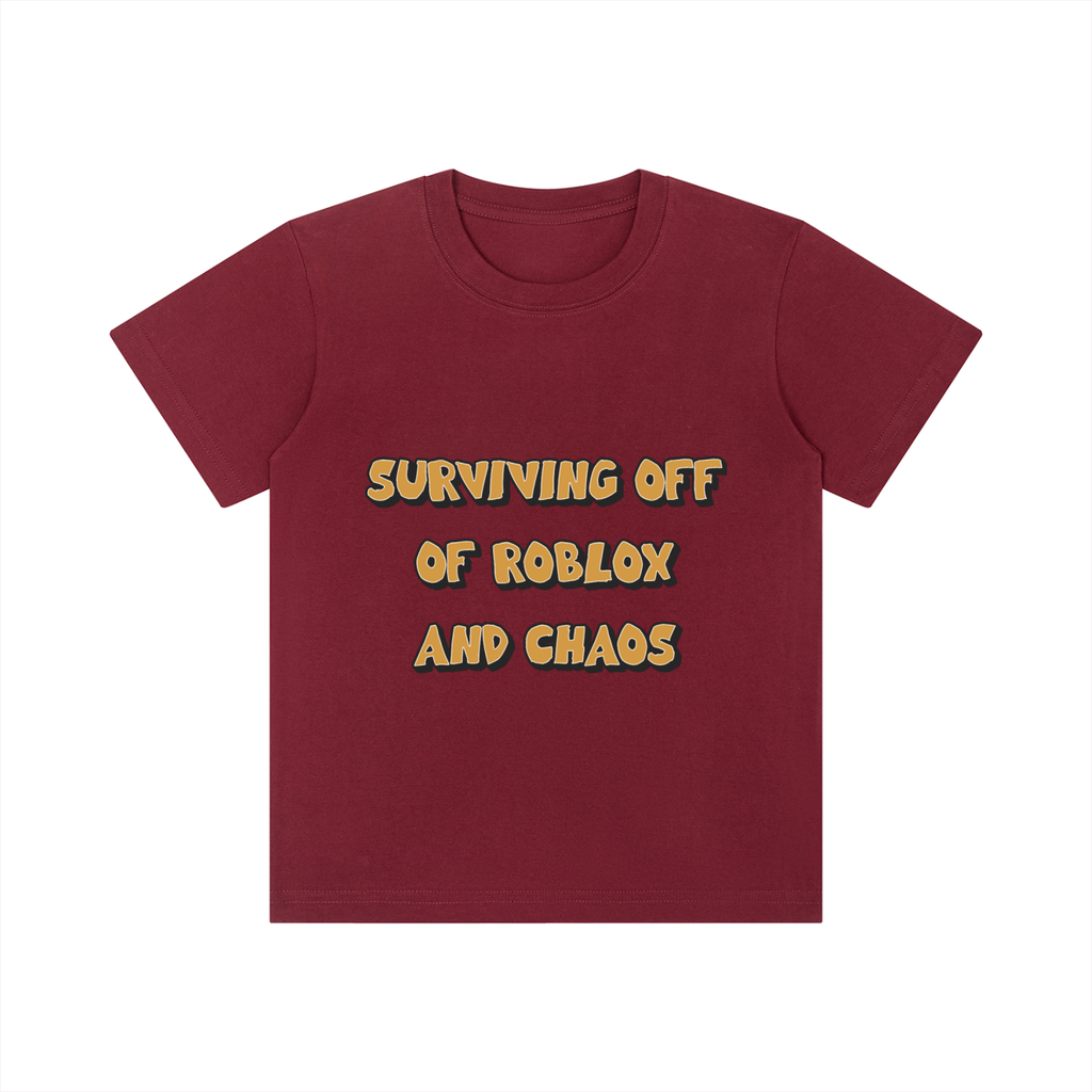 A maroon short-sleeve t-shirt with the text 'SURVIVING OFF OF ROBLOX AND CHAOS' printed on the chest in a yellow font with a dark outline, displayed on a solid white background.