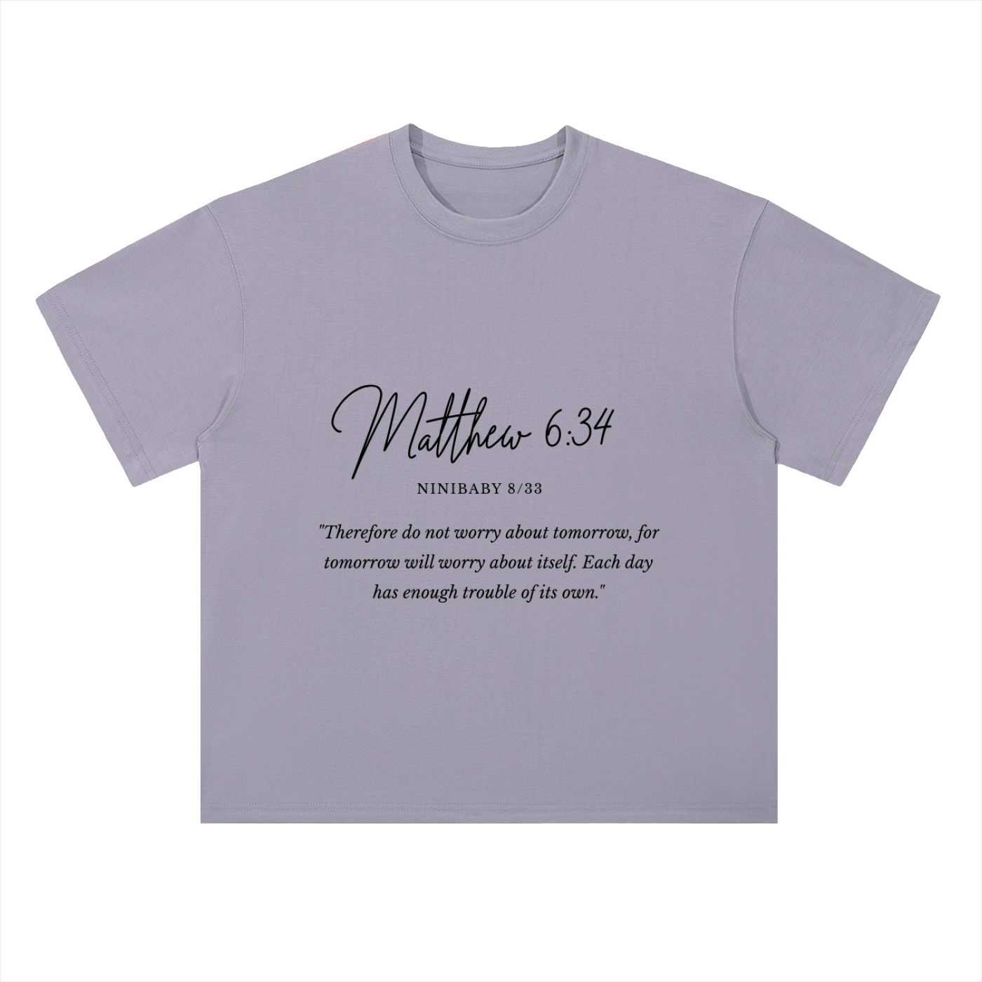 A light lavender-gray short-sleeve t-shirt with a black printed Bible verse quote from Matthew 6:34 on the chest, displayed flat against a white background.