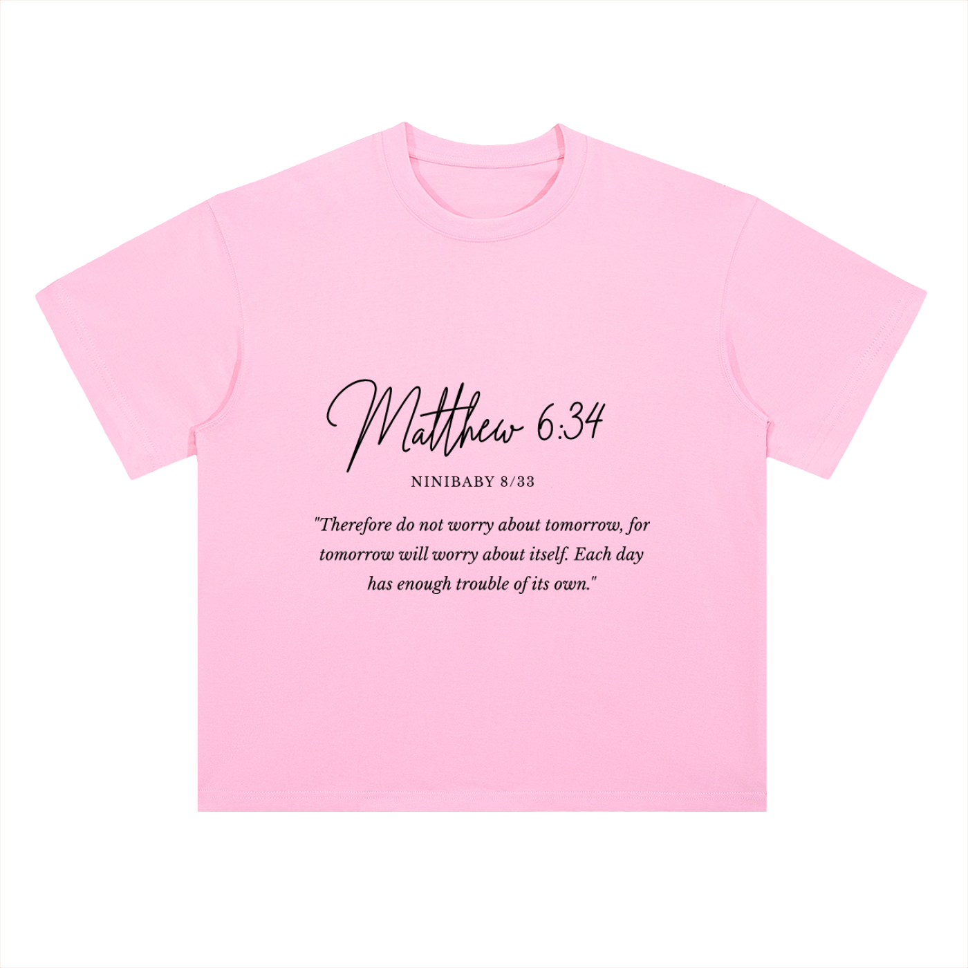 A light pink short-sleeve t-shirt with black printed text on the front reading 'Matthew 6:34' and a Bible verse below it, shown on a plain white background.