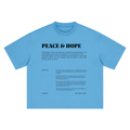A light blue short-sleeve t-shirt shown flat against a white background, featuring black printed text on the back with the title 'PEACE & HOPE' and a Bible verse from Philippians 4:13.