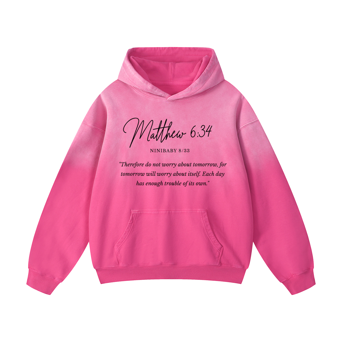 A bright pink pullover hoodie with a front kangaroo pocket and a black printed Bible verse quote on the chest reading 'Matthew 6:34' and 'NINIBAY 8:23'.