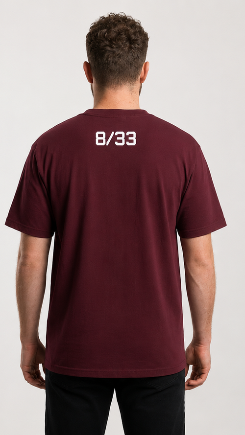 A man modeling a maroon short-sleeve t-shirt, shown from both the front and back. The front features a large graphic print of an anime-style woman on a red motorcycle.
